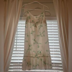 White spaghetti strap dress with green flowers